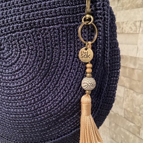 The Sak Ryder crochet crescent crossbody bag in navy blue with a tassel - Picture 3 of 14